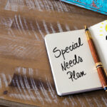 Classic fountain pen and open notebook on wooden table